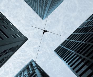 An acrobat between buildings