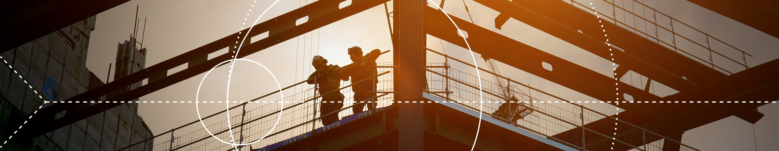 hiker on a via ferrata, secured by a rope, looking into a beautiful mountain landscape