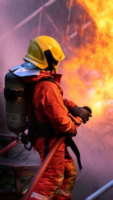 Image of a firefighter fighting a fire 