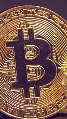 Image of a gold coin with a bitcoin symbol on it 
