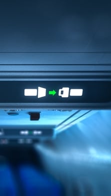 Image of a 'no-smoking' and ' seatbelt on' sign in an airplane 