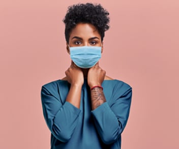 Image of a woman using a medical mask 