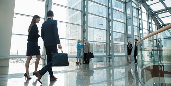 Photo of people in an office building lobby 