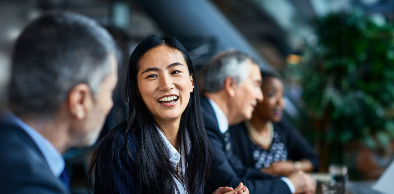 Business partners ( focus on a woman) having a lively conversation