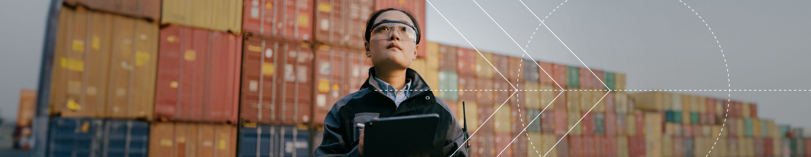 Female cargo specialist, many cargo containers in the background